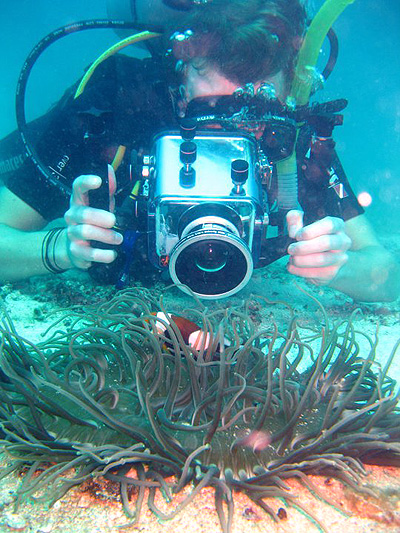 student filming nemo